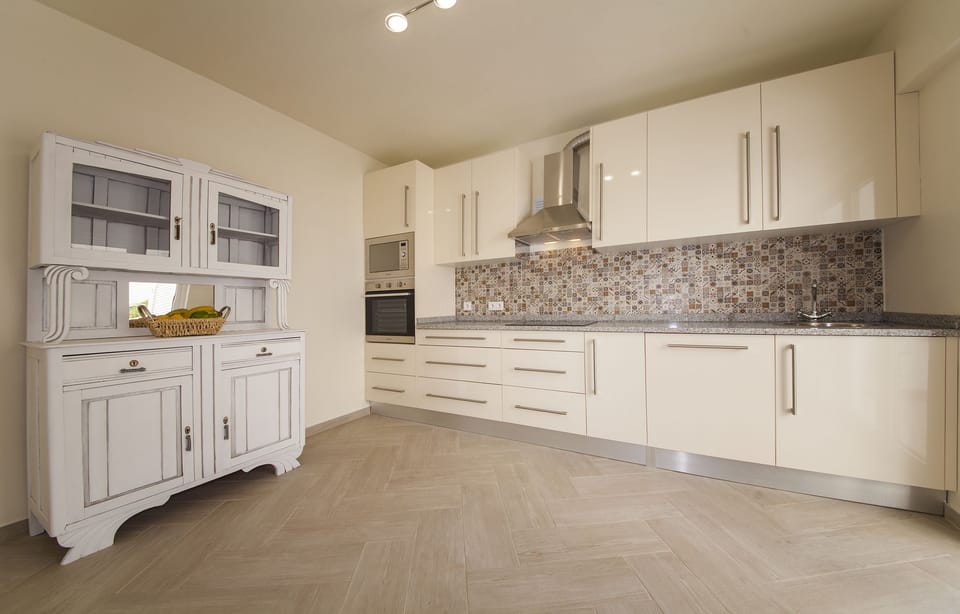 Apartment, 3 Bedrooms | Private kitchen | Full-size fridge, microwave, oven, stovetop