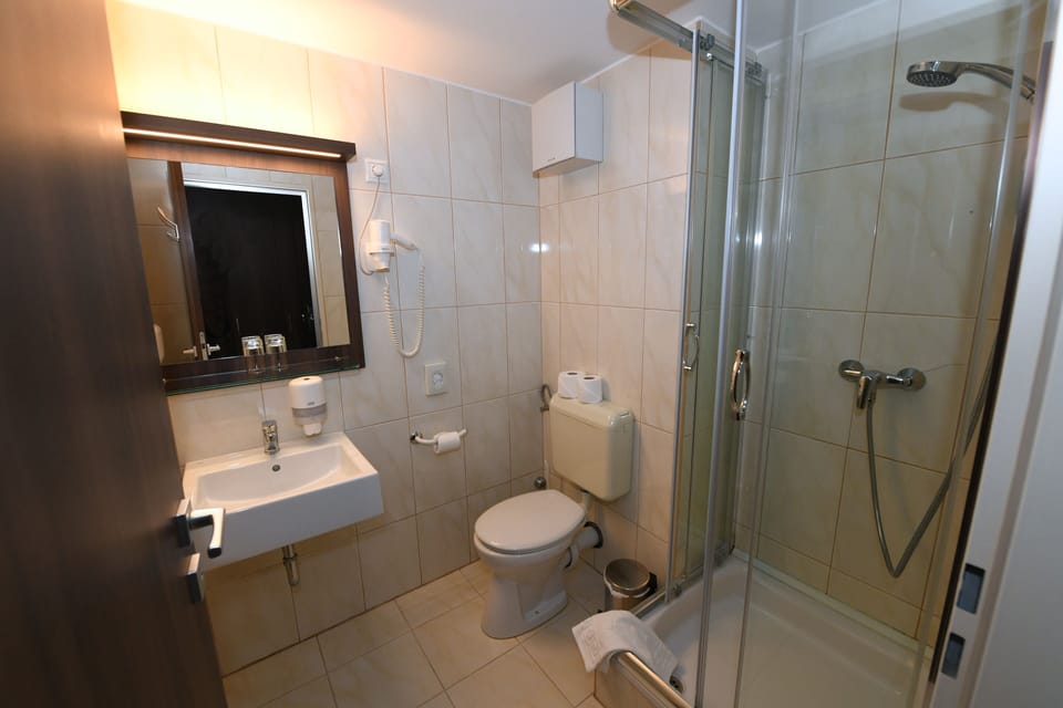 Shower, bathrobes, towels, soap