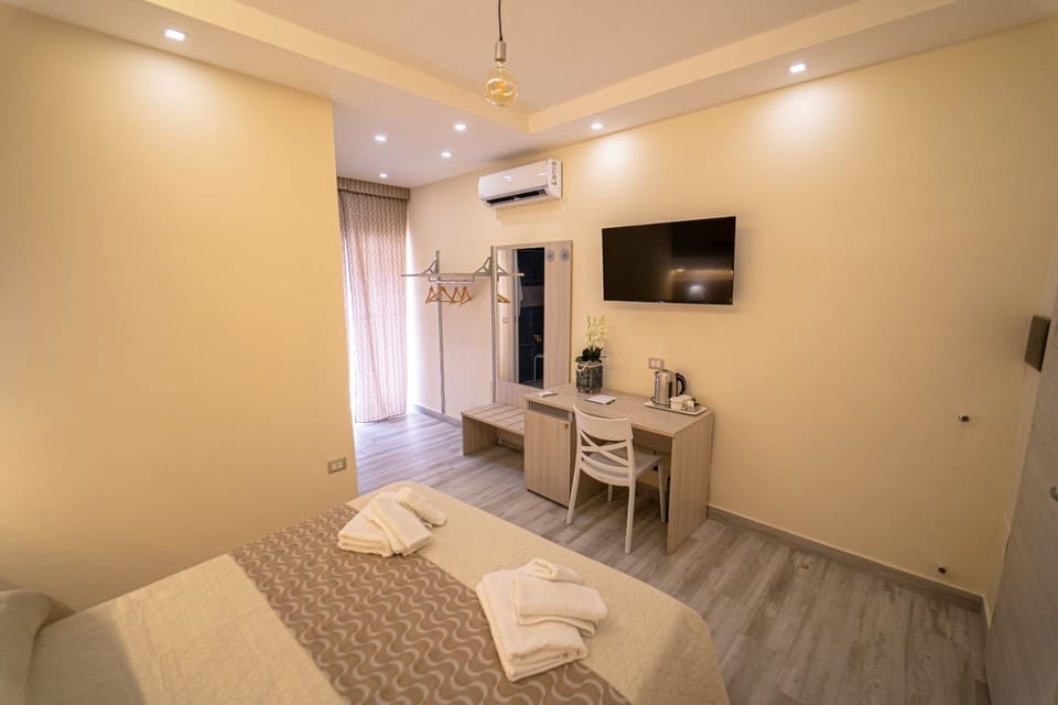 Deluxe Quadruple Room | Premium bedding, down comforters, minibar, individually furnished
