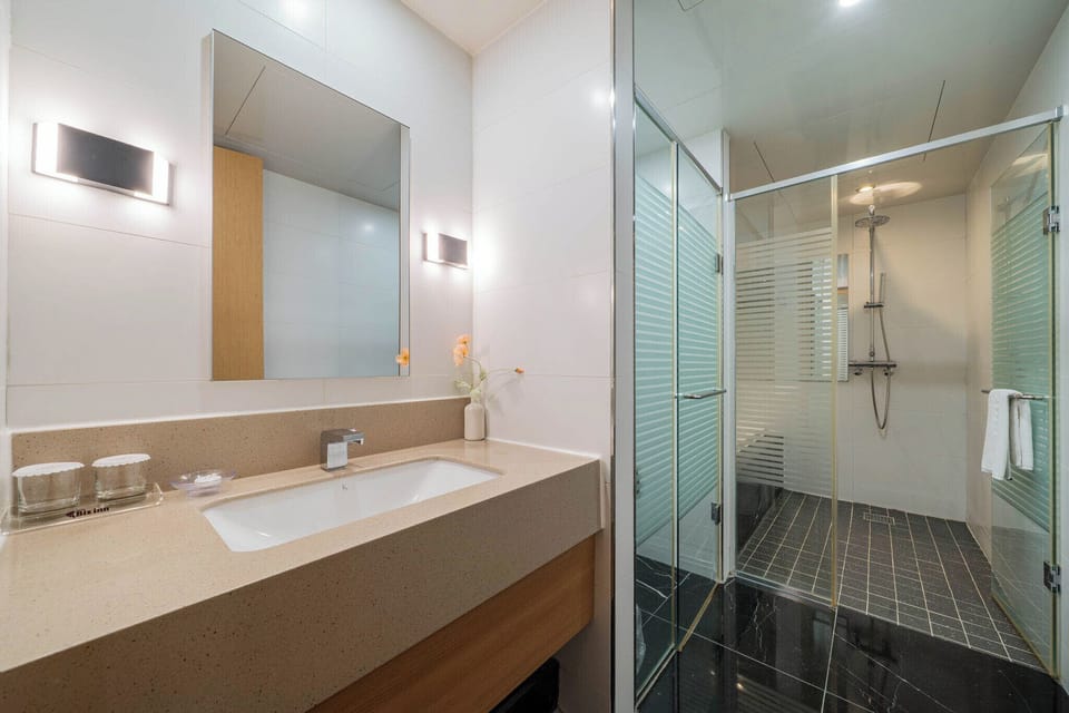 Family Suite | Bathroom | Designer toiletries, hair dryer, bathrobes, slippers