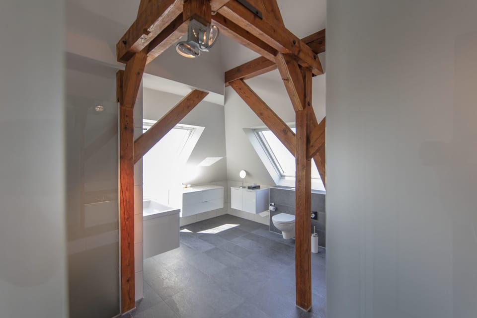 Suite (OnTheTop) | Bathroom | Hair dryer, bathrobes, slippers, towels