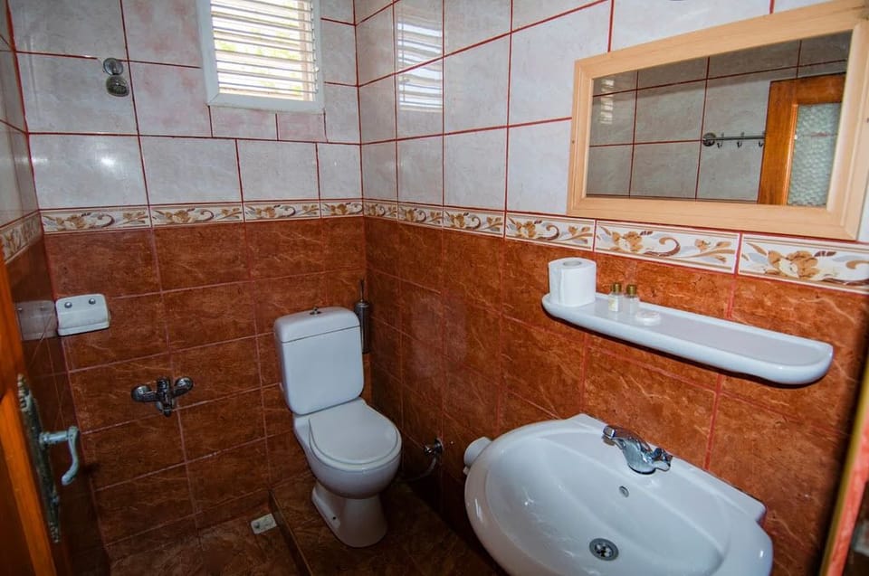 Shower, slippers, towels, soap