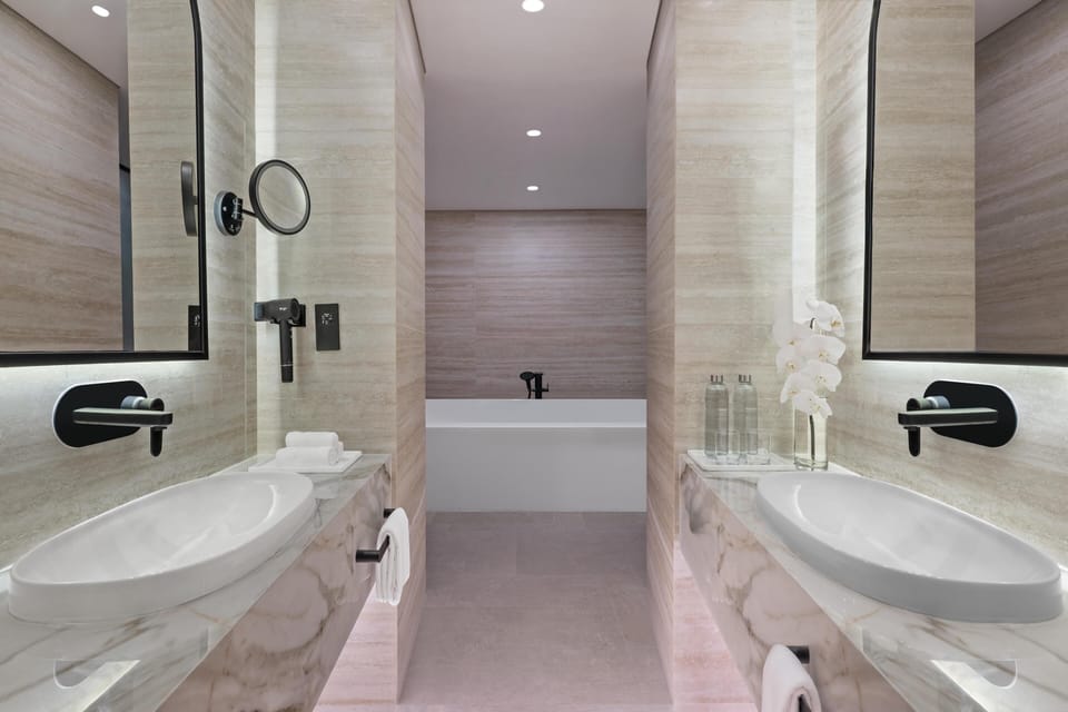 2 Bedroom Presidential Suite, Newly Renovated, Living & Dining Area, Evening Drinks & Canape Section | Bathroom | Separate tub and shower, free toiletries, hair dryer, bathrobes