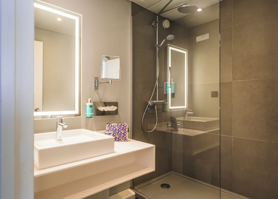 Shower, eco-friendly toiletries, hair dryer, towels