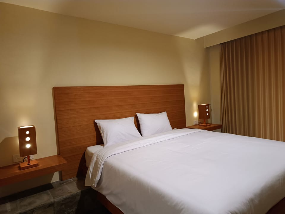 Deluxe Double Room, Pool View | Desk, blackout drapes, soundproofing, free WiFi