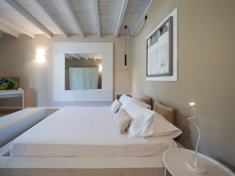 DESIGN FAMILY | Frette Italian sheets, down comforters, individually decorated