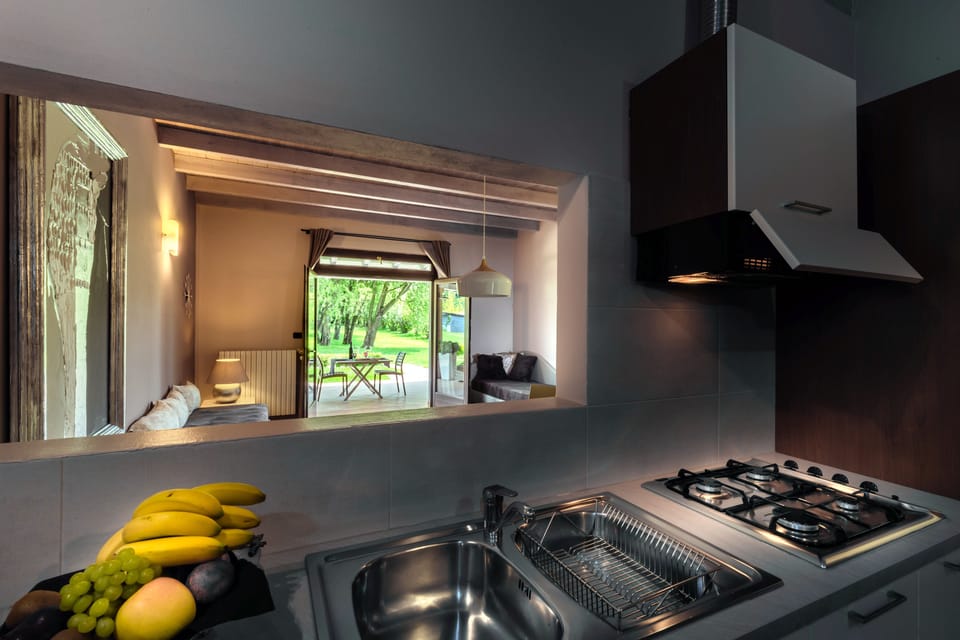 JUNIOR SUITE FAMILIARE CON 2 CAMERE DA LETTO | Private kitchen | Fridge, coffee/tea maker