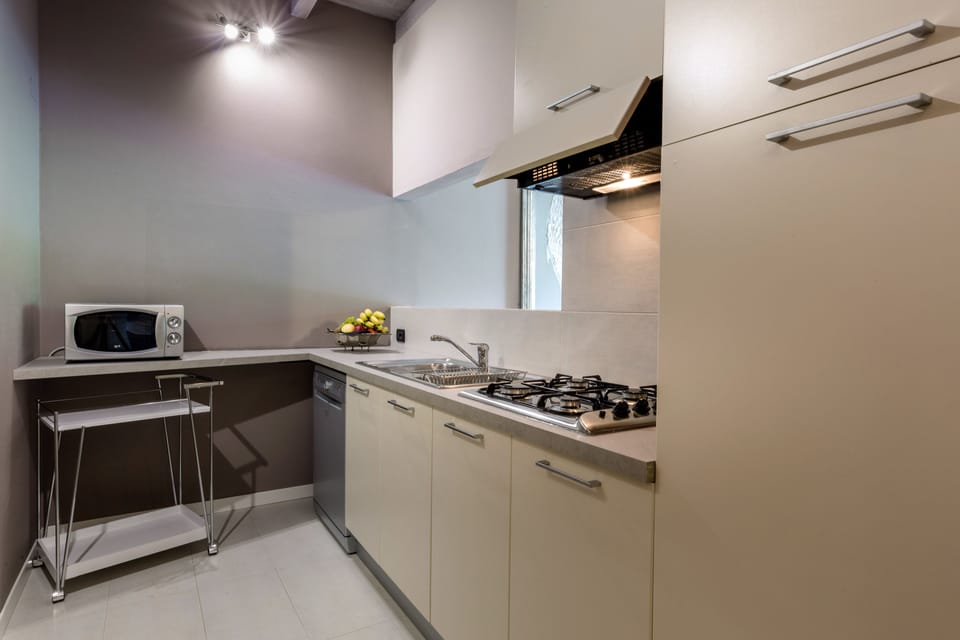 JUNIOR SUITE FAMILIARE CON 2 CAMERE DA LETTO | Private kitchen | Fridge, coffee/tea maker