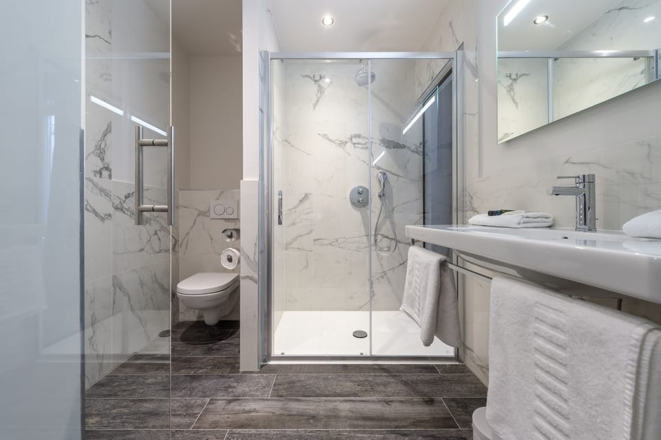 Deep soaking tub, rainfall showerhead, towels