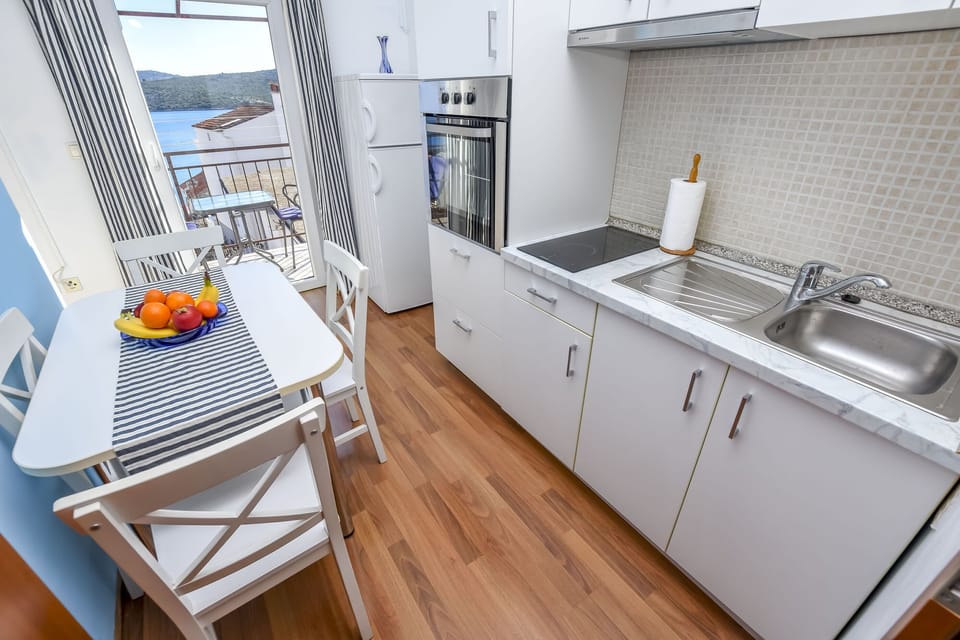 Apartment (A2) | Private kitchen | Fridge, stovetop, electric kettle, toaster