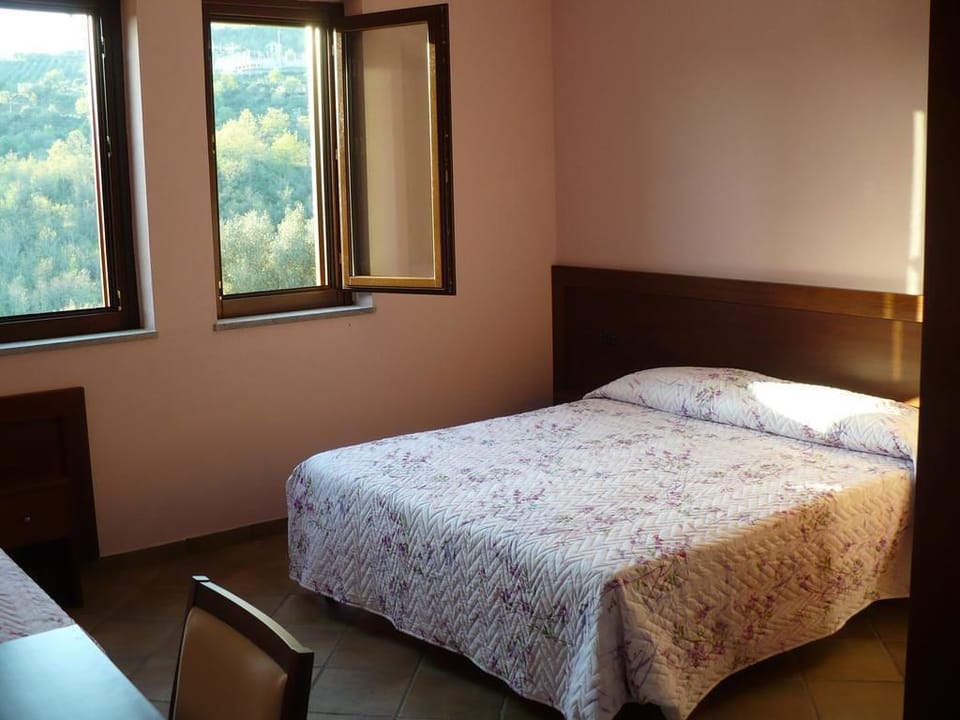 Standard Triple Room, Garden View | Desk, cribs/infant beds, bed sheets