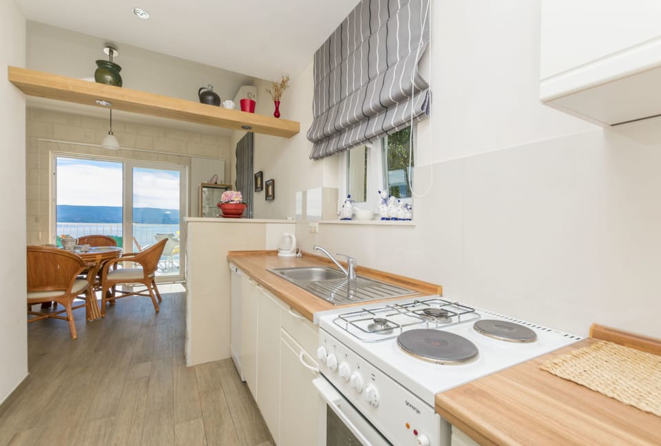 Apartment (A2) | Private kitchen | Fridge, oven, stovetop, dishwasher