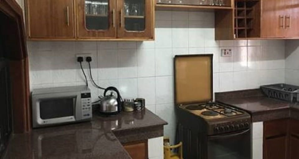 Comfort Apartment, 2 Bedrooms | Private kitchen | Full-size fridge, microwave, stovetop, electric kettle