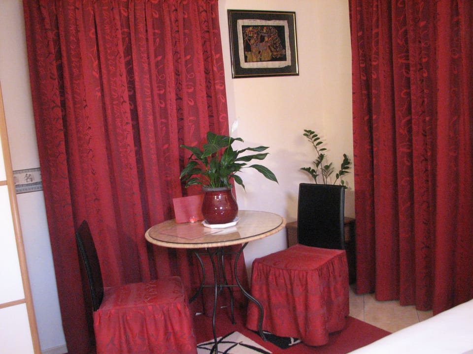Comfort Triple Room | Living area | Flat-screen TV