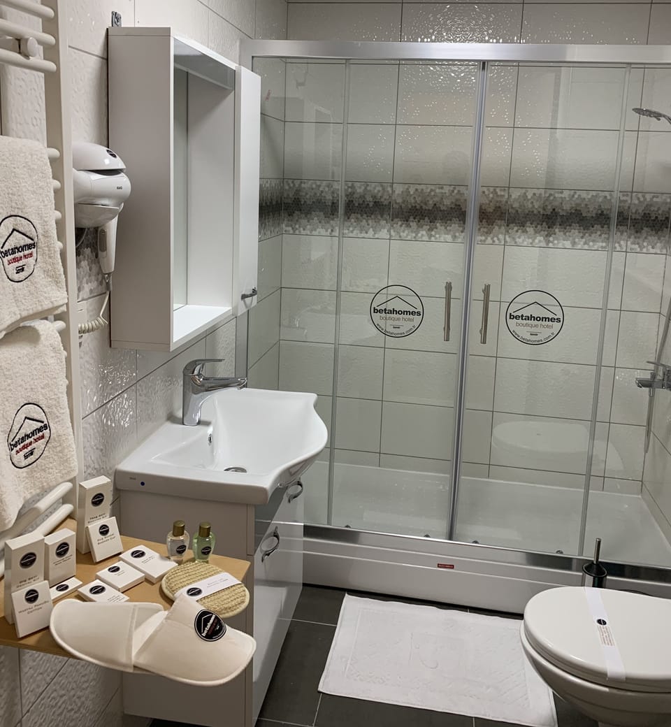 Shower, free toiletries, hair dryer, slippers