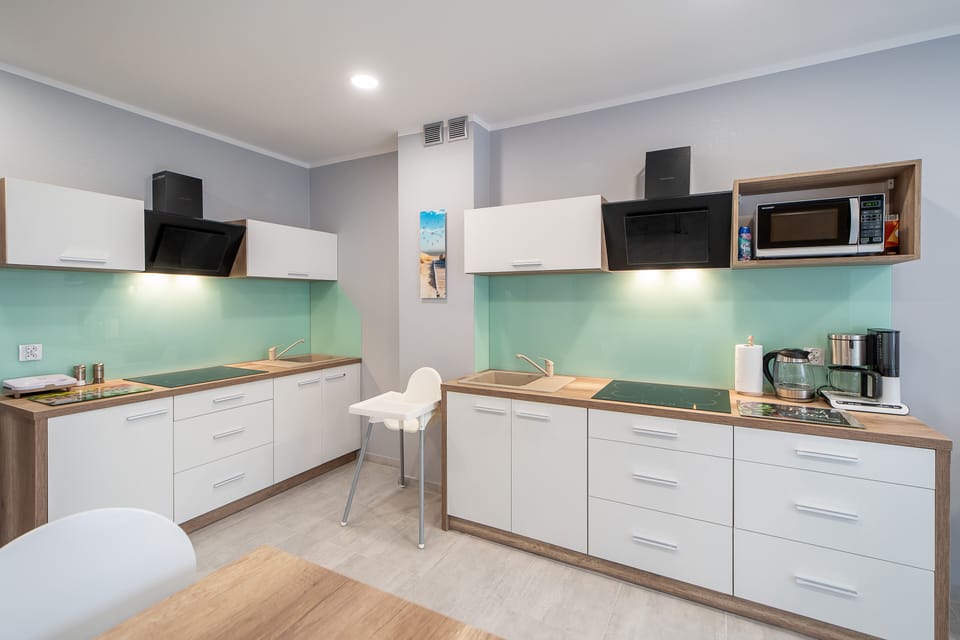 Fridge, coffee/tea maker, electric kettle, cookware/dishes/utensils