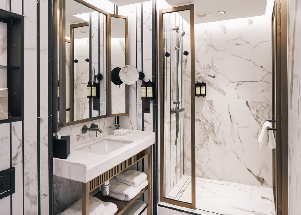 Designer toiletries, hair dryer, bathrobes, slippers