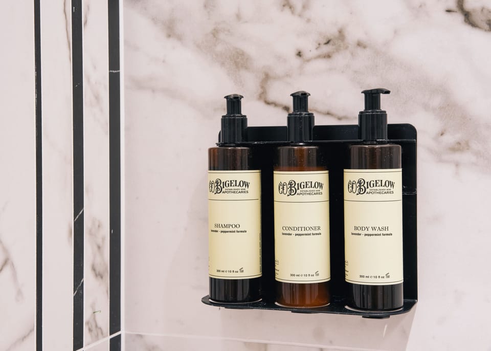 Designer toiletries, hair dryer, bathrobes, slippers