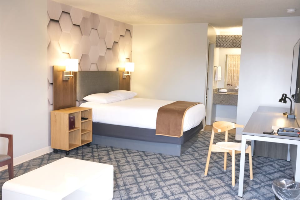 Design Studio | Premium bedding, desk, laptop workspace, blackout drapes