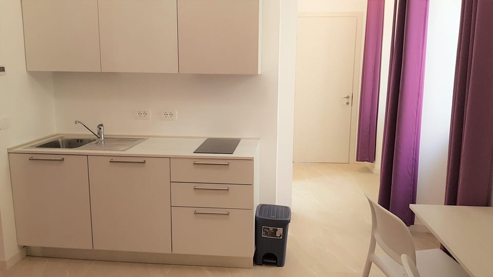 Superior Apartment (Glicine) | Private kitchenette | Full-size fridge, microwave, stovetop, coffee/tea maker
