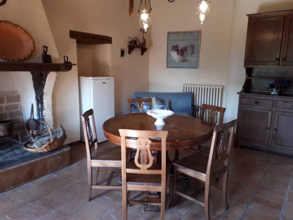 Apartment, 2 Bedrooms (Fiordaliso) | Living area | Fireplace, books