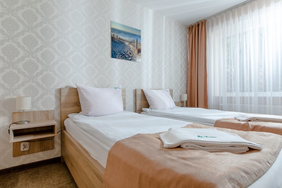 Double or Twin Room | Desk, blackout drapes, rollaway beds, bed sheets