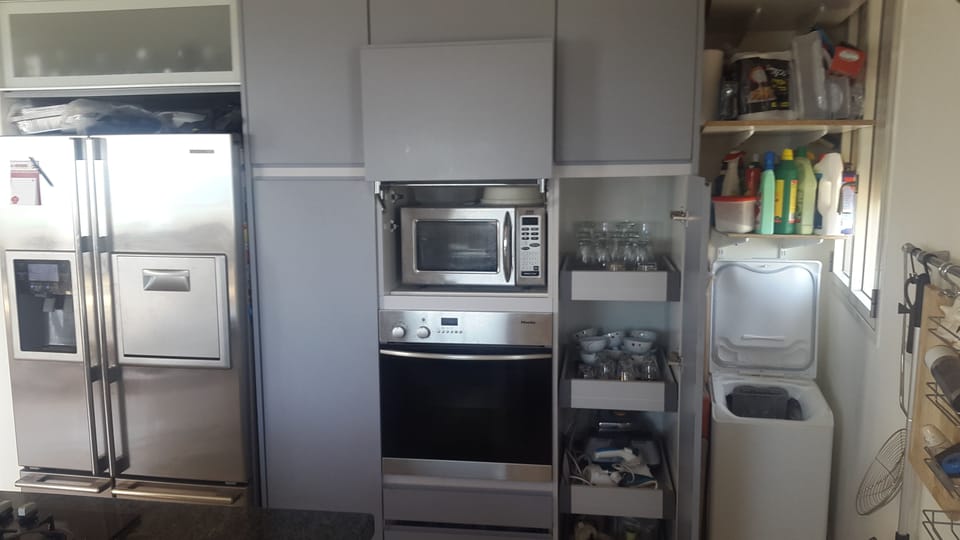 Exclusive Penthouse | Private kitchen | Full-size fridge, microwave, oven, stovetop