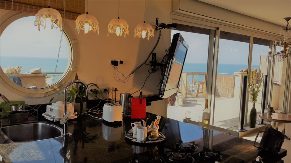 Exclusive Penthouse | Private kitchen | Full-size fridge, microwave, oven, stovetop