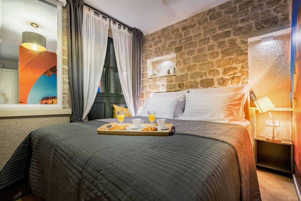 Standard Double Room | Minibar, in-room safe, desk, blackout drapes