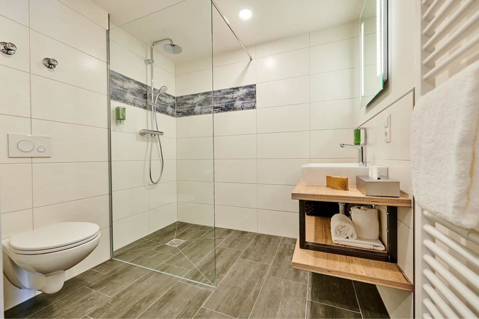 Shower, rainfall showerhead, hair dryer, towels