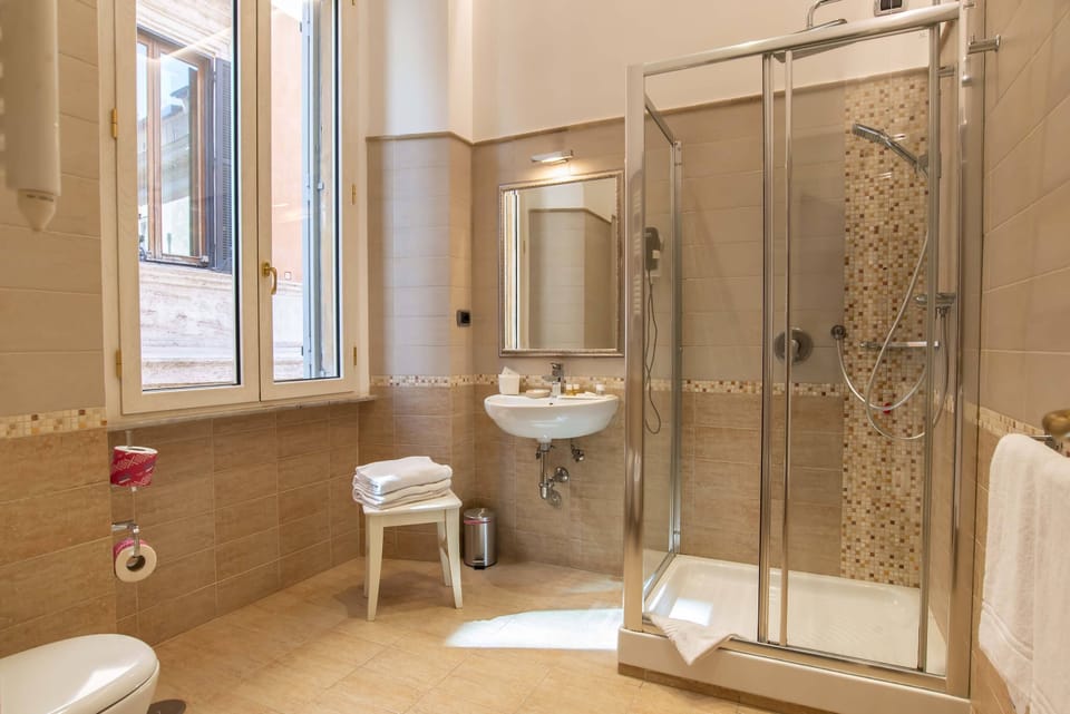 Shower, rainfall showerhead, free toiletries, hair dryer