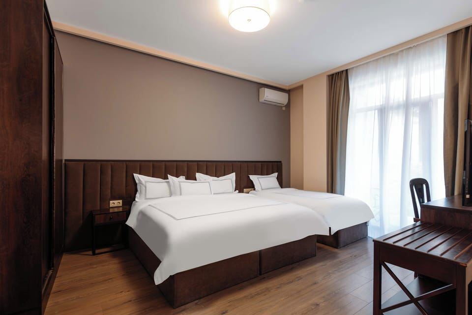 Family Quadruple Room, Multiple Beds, Non Smoking, Garden View | Premium bedding, memory foam beds, minibar, in-room safe