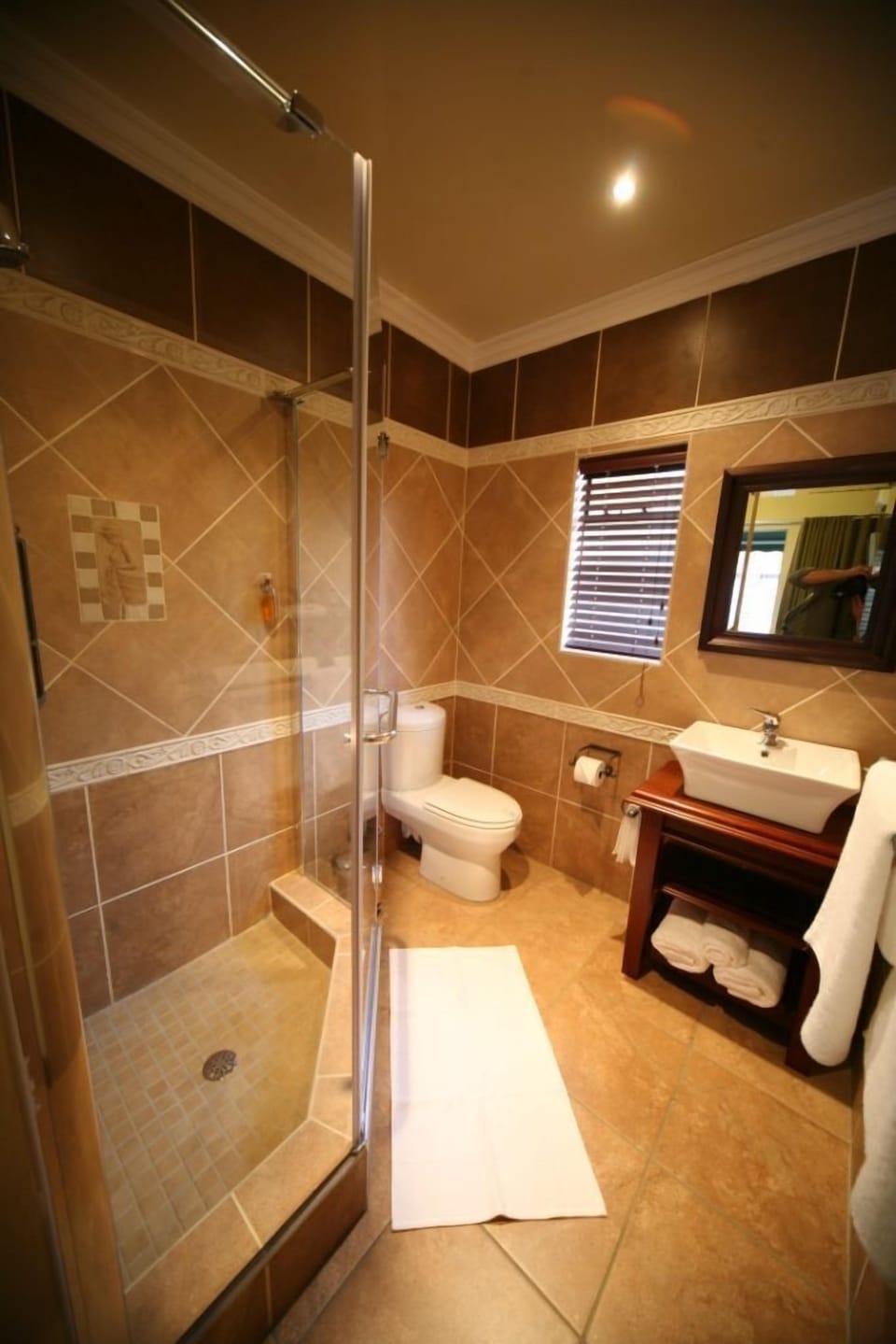 Deep soaking tub, rainfall showerhead, hair dryer, towels