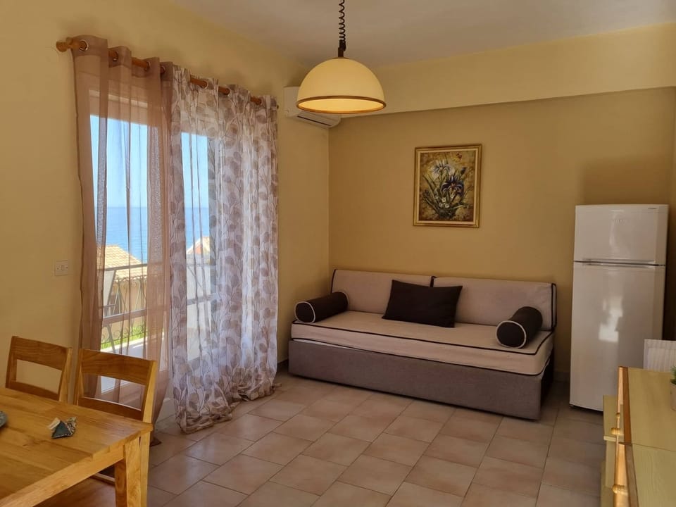 Apartment, 1 Bedroom, Sea View | Living area | TV