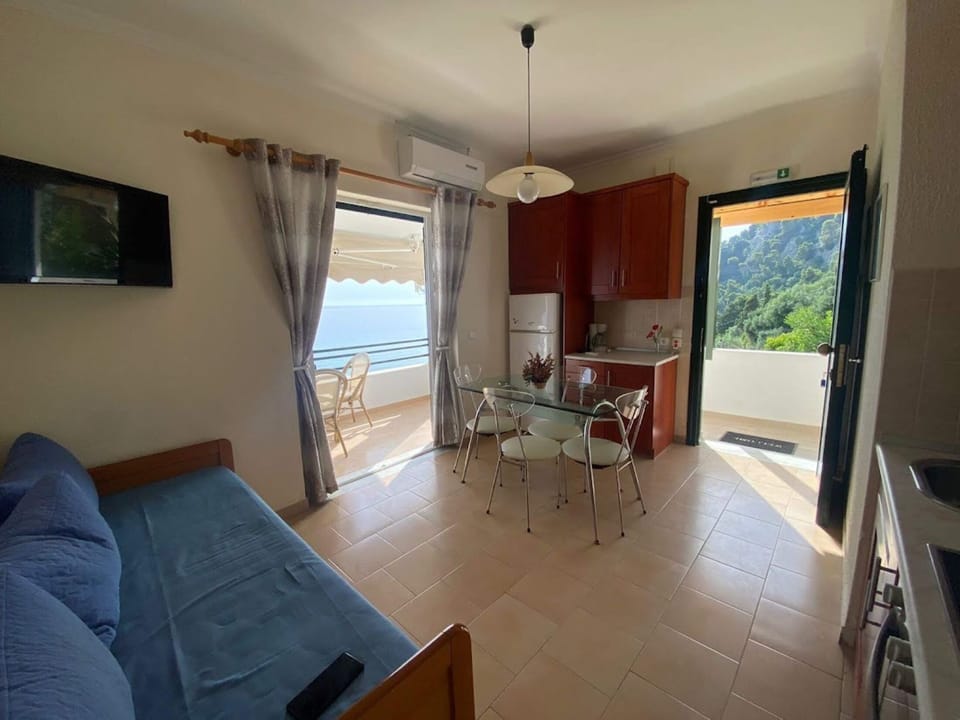 Apartment, 1 Bedroom | Living area | Flat-screen TV