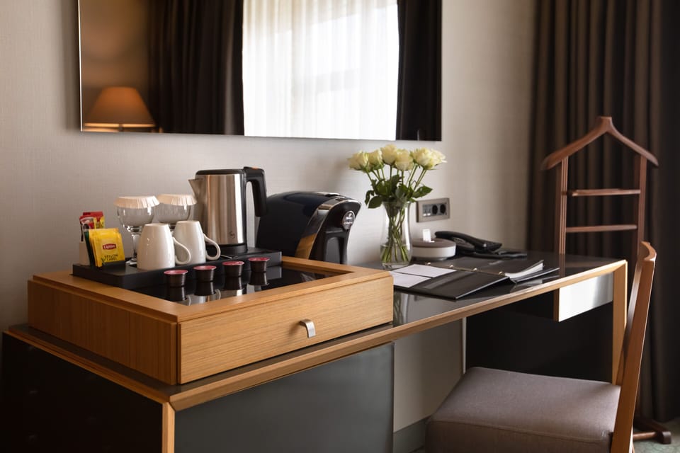 Premium bedding, down comforters, minibar, in-room safe