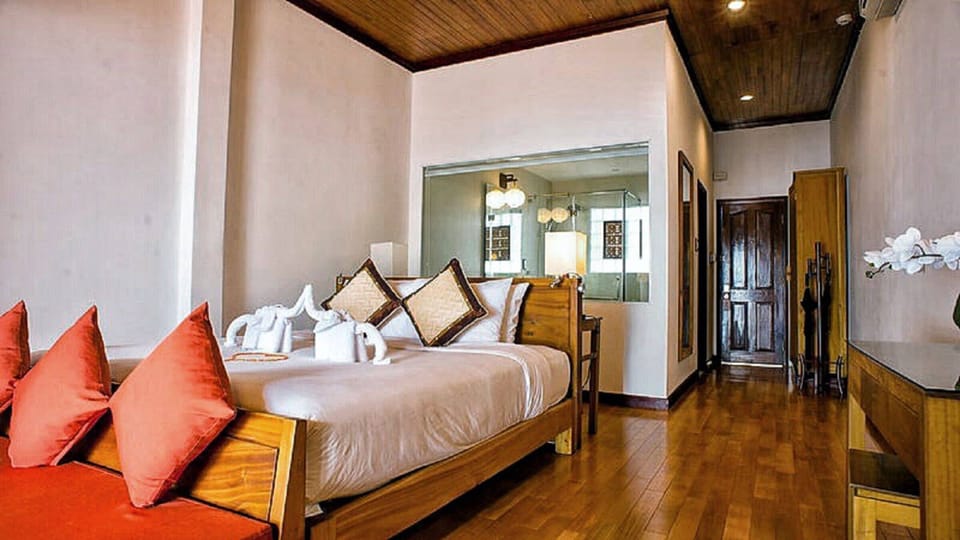 Deluxe Room, River View | Down comforters, minibar, in-room safe, individually decorated