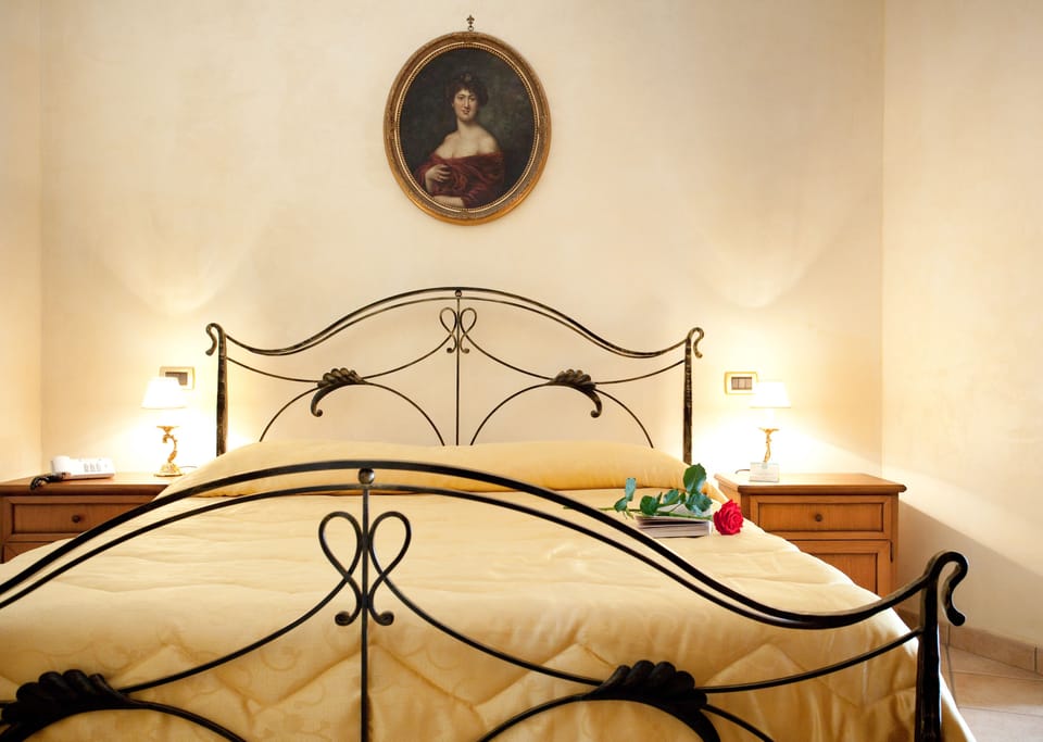 Quadruple Room, 1 Bedroom | Down comforters, in-room safe, iron/ironing board