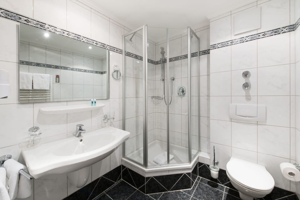 Shower, hair dryer, bathrobes, slippers
