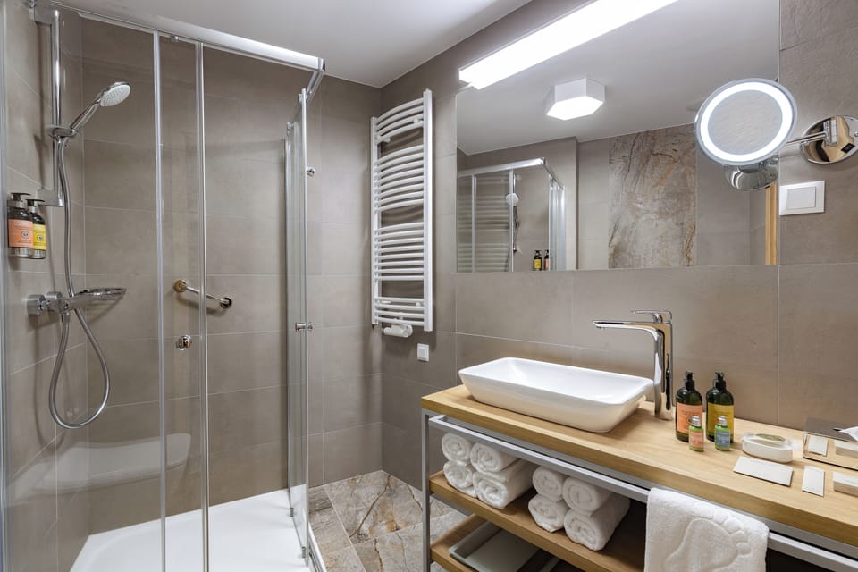 Superior Room | Bathroom | Shower, hair dryer, bathrobes, slippers