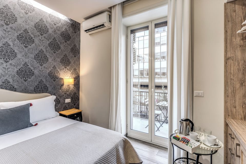Deluxe Quadruple Room | Minibar, in-room safe, individually decorated, individually furnished