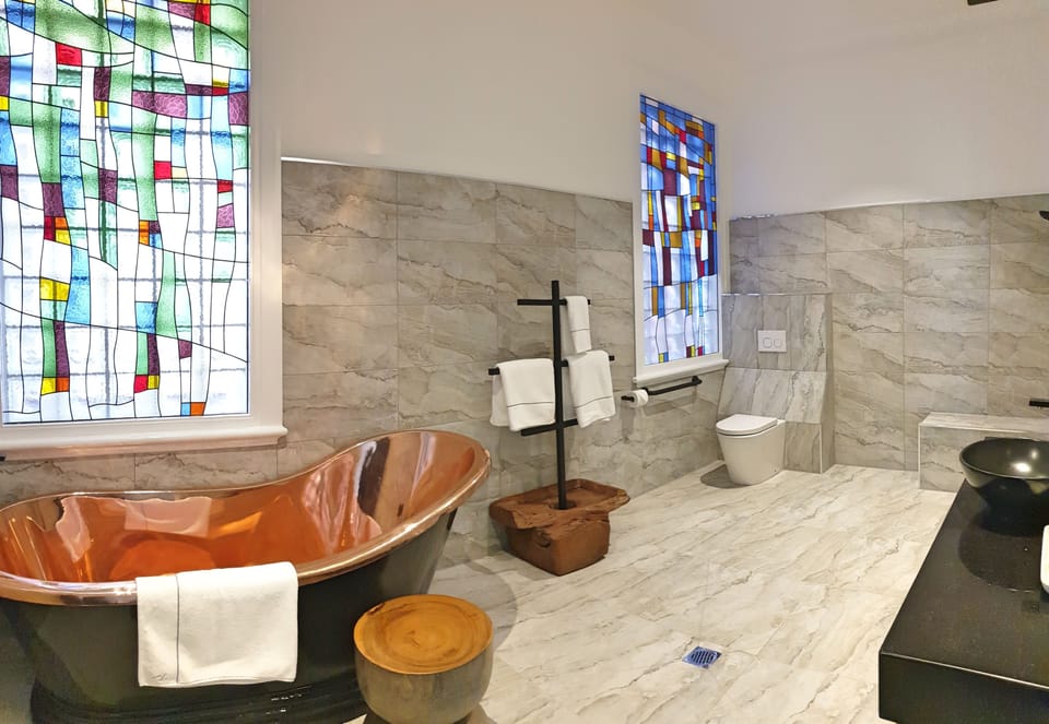 Warhol Suite | Bathroom | Separate tub and shower, deep soaking tub, rainfall showerhead