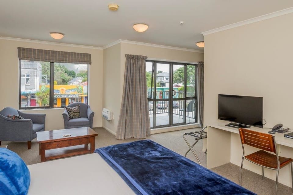 Superior Studio | Individually decorated, desk, laptop workspace, blackout drapes
