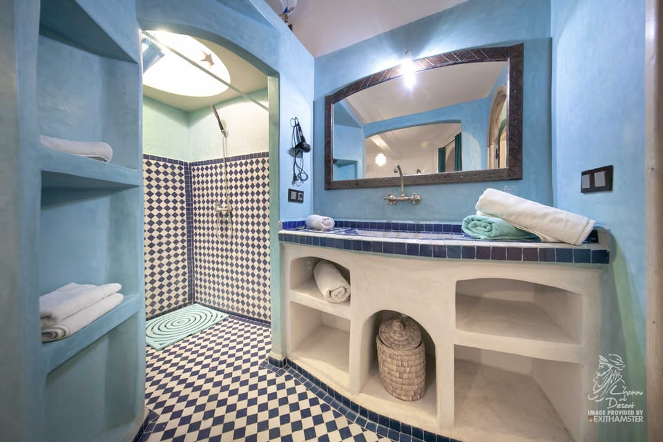 Shower, rainfall showerhead, hair dryer, towels