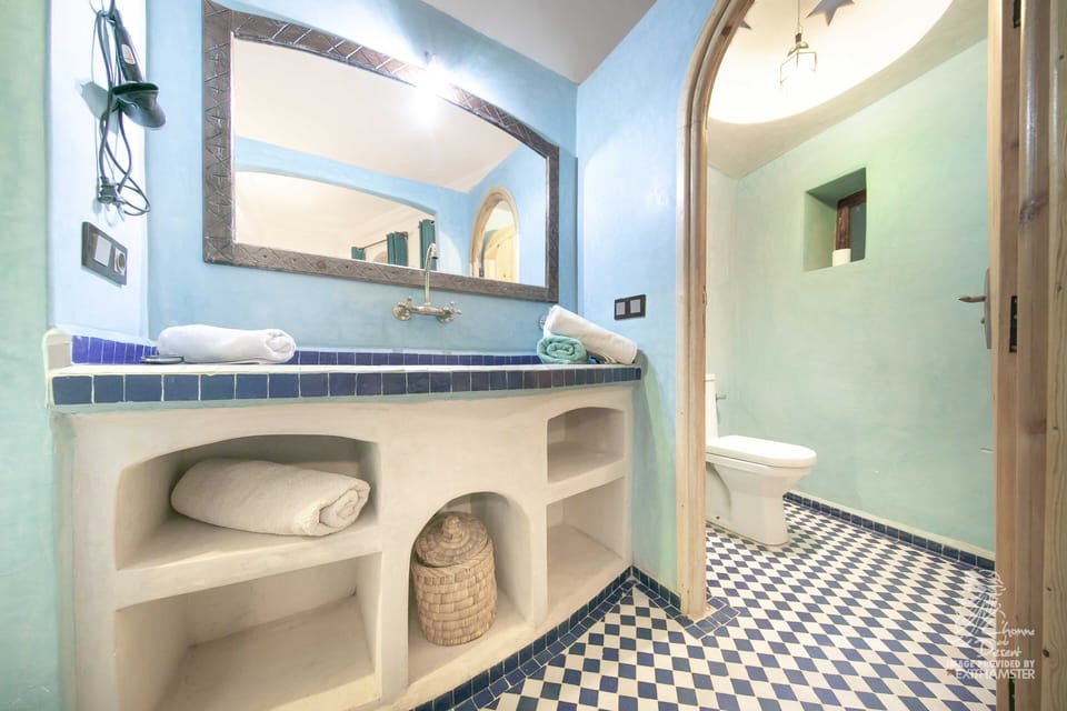 Shower, rainfall showerhead, hair dryer, towels