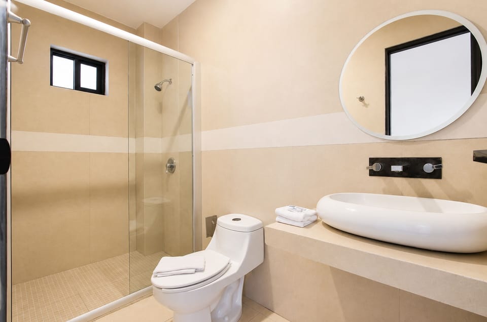 Deluxe Suite, 2 Double Beds, Microwave | Bathroom | Shower, free toiletries, towels, soap