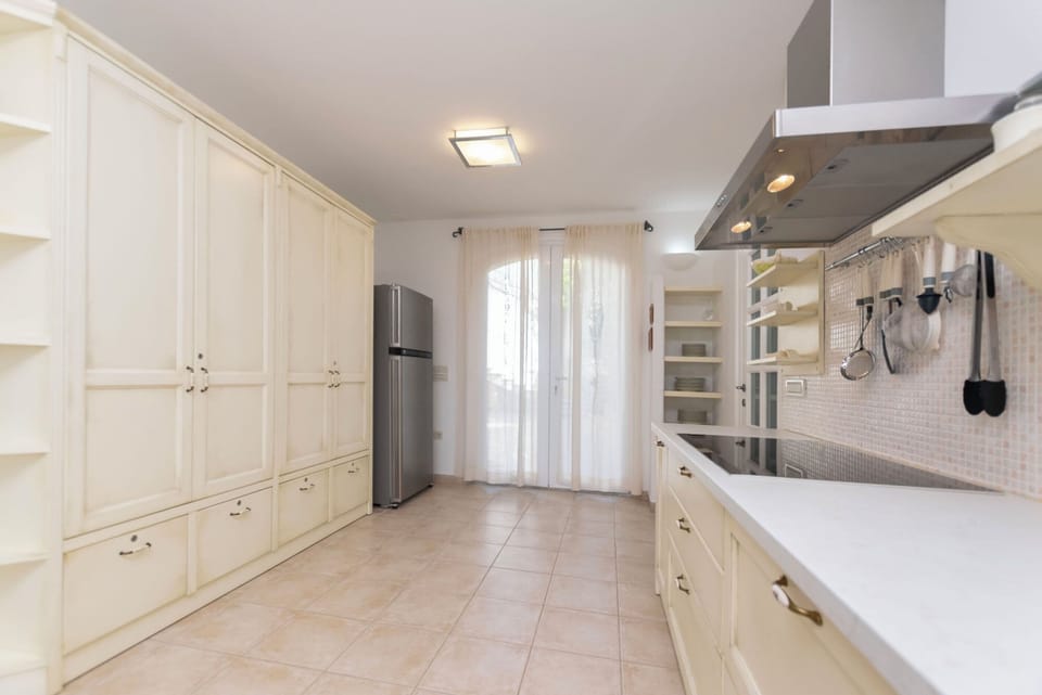 Villa | Private kitchen | Fridge, microwave, oven, stovetop