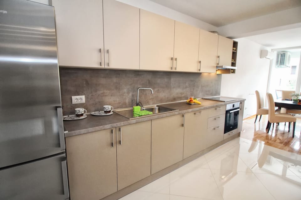 Deluxe Apartment | Private kitchen | Fridge