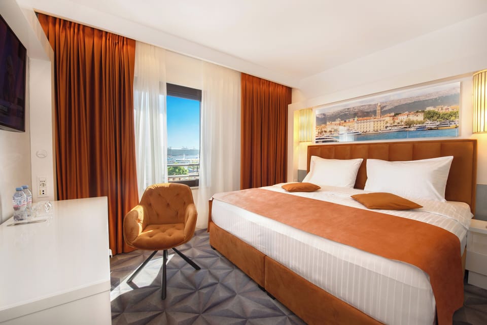 Standard Double Room, Partial Sea View | Premium bedding, in-room safe, desk, blackout drapes