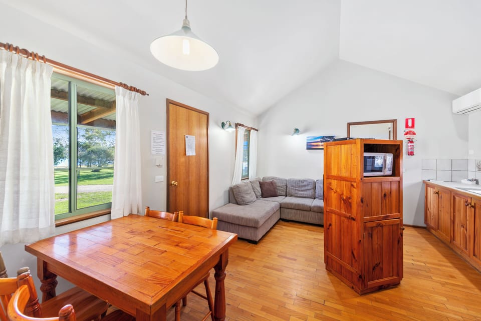 Cedar Hut | Living area | Flat-screen TV, table tennis, books, video library